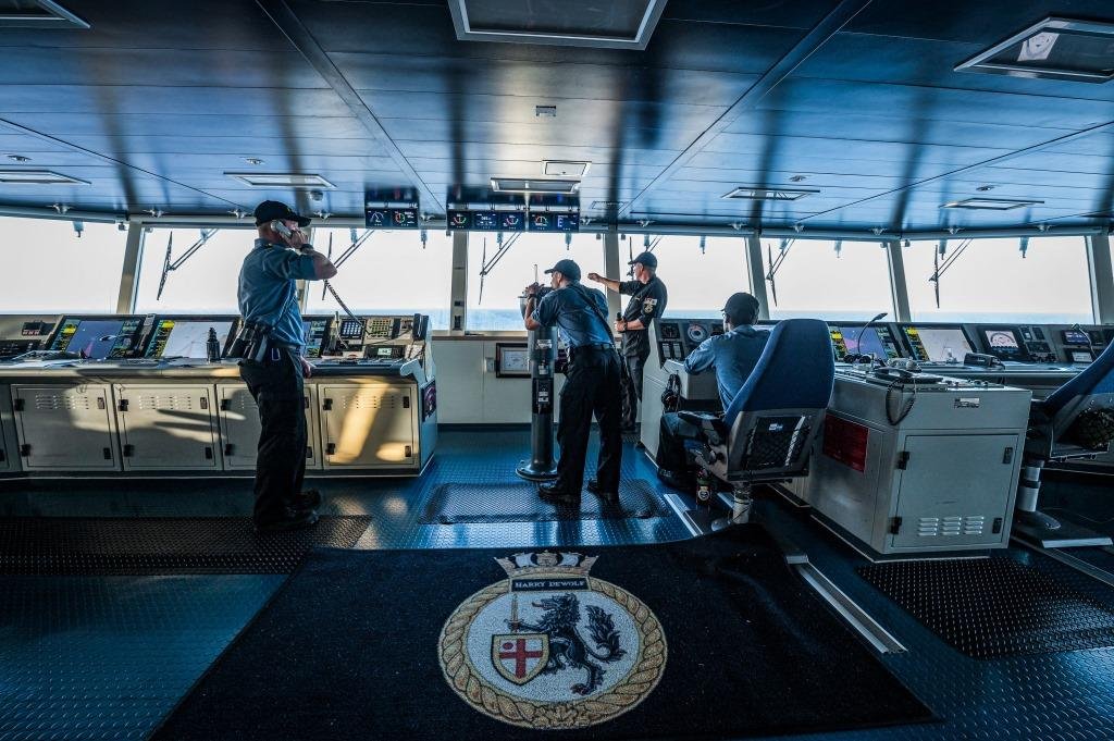 Crewmembers carry out their duties on the bridge of HMCS HARRY DEWOLF during Operation CARIBBE, May 3, 2022. - Credit: CAF